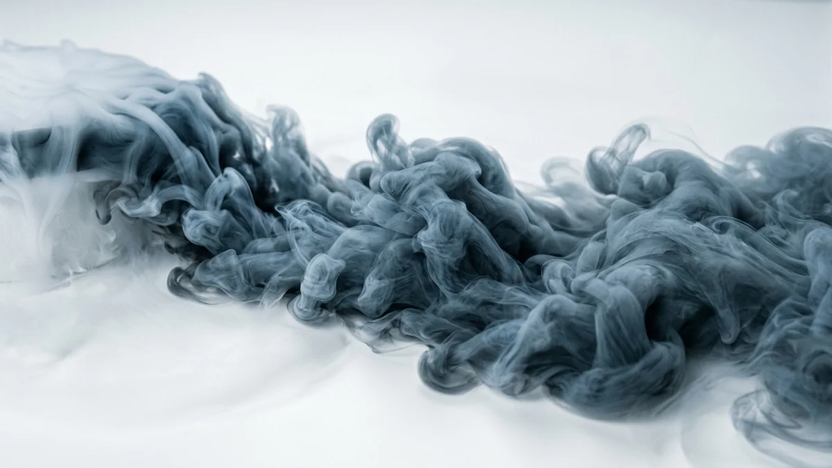 Cold vapour curling low across a bright white surface.