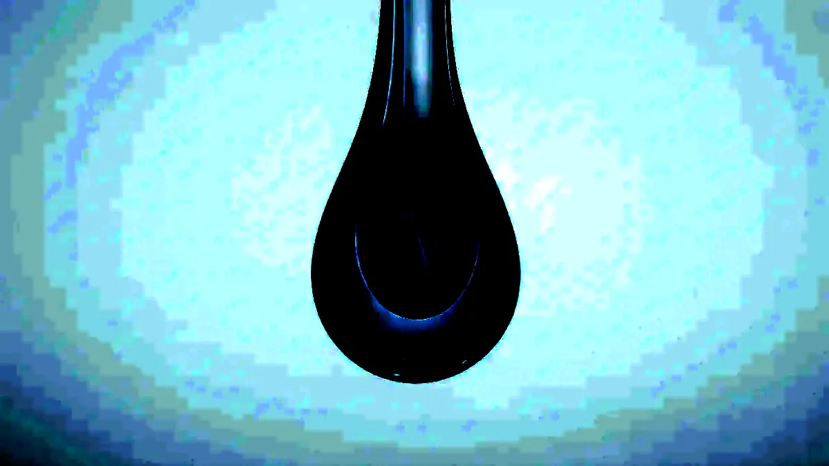 A thick droplet of clear gel suspended mid-fall against a white ground.