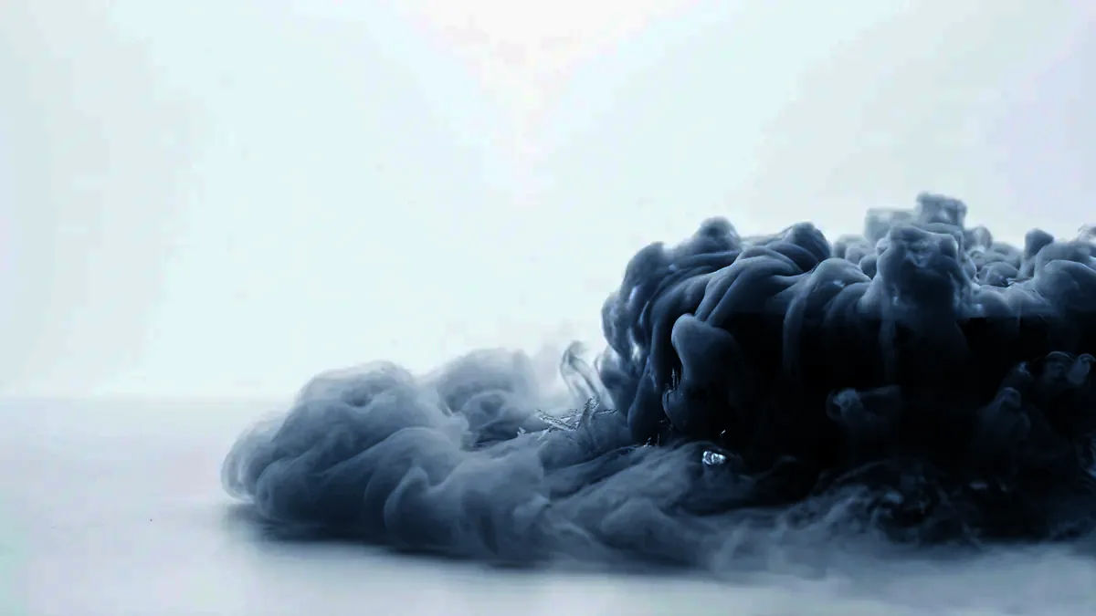 Cold vapour curling low across a bright white surface.